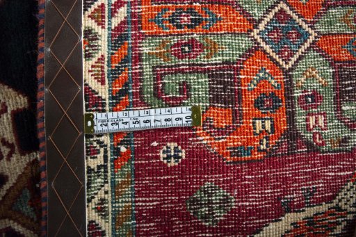 Surface texture of 2000s Shiraz rug with natural Wool and intricate pattern