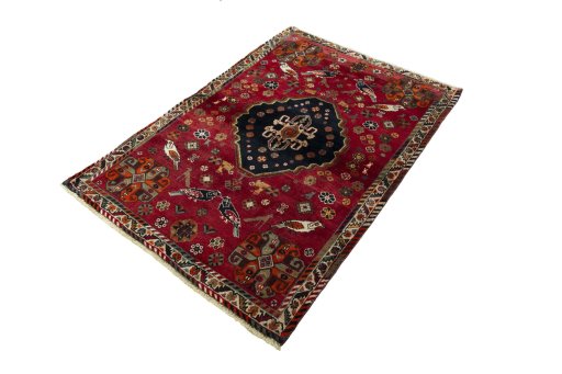 Corner detail of 2000s Shiraz rug showing border pattern and Wool pile