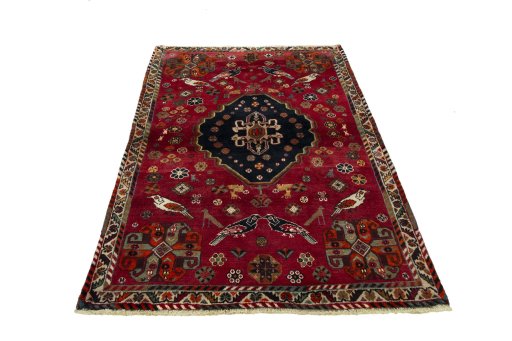 Surface texture of 2000s Shiraz rug with natural Wool and intricate pattern
