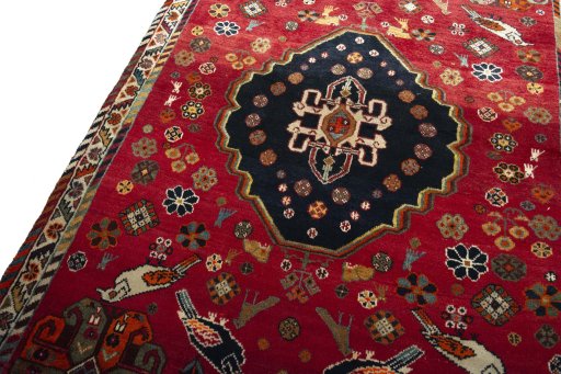 Backside of handmade 2000s Shiraz rug showing knot structure and weave density
