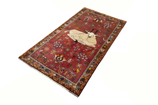 Corner detail of 2000s Shiraz rug showing border pattern and Wool pile