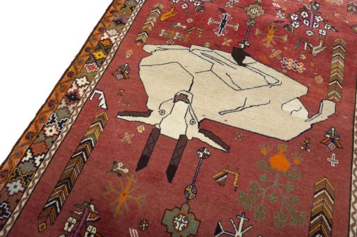 Backside of handmade 2000s Shiraz rug showing knot structure and weave density