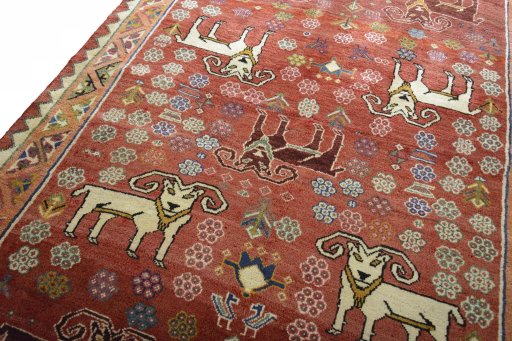Backside of handmade 2000s Shiraz rug showing knot structure and weave density