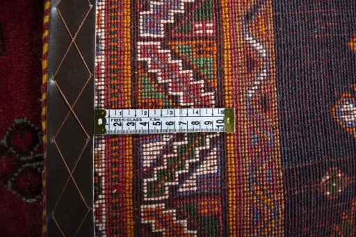 Backside of handmade 2000s Shiraz rug showing knot structure and weave density
