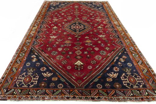 Surface texture of 2000s Shiraz rug with natural Wool and intricate pattern