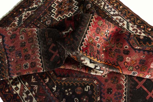 Surface texture of 2000s Shiraz rug with natural Wool and intricate pattern