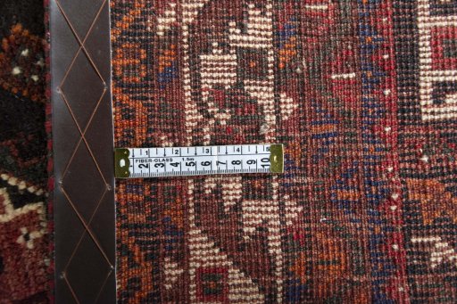 Backside of handmade 2000s Shiraz rug showing knot structure and weave density