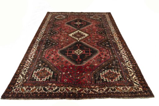 Surface texture of 2000s Shiraz rug with natural Wool and intricate pattern