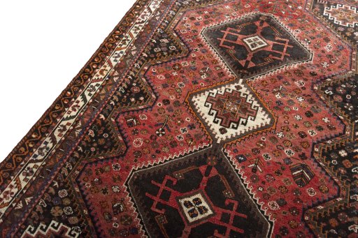 Backside of handmade 2000s Shiraz rug showing knot structure and weave density