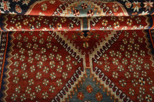 Full view of 2000s Shiraz rug from Iran / Persia, 273 × 147 cm in Red tones