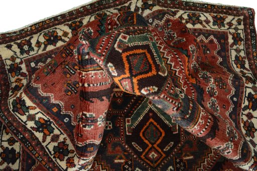 Corner detail of 2000s Shiraz rug showing border pattern and Wool pile