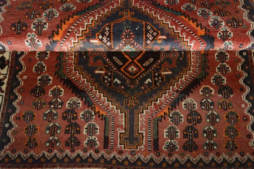 Full view of 2000s Shiraz rug from Iran / Persia, 160 × 104 cm in Red tones