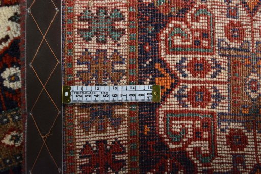 Surface texture of 2000s Shiraz rug with natural Cotton and intricate pattern
