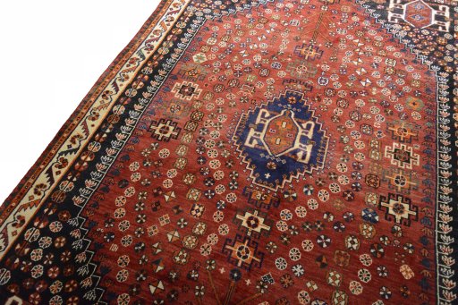 Backside of handmade 2000s Shiraz rug showing knot structure and weave density