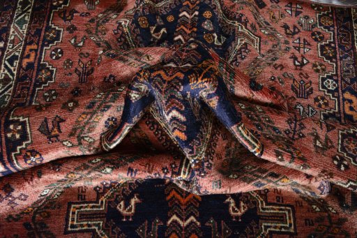 Corner detail of 2000s Shiraz rug showing border pattern and Wool pile
