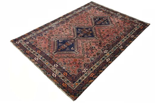 Corner detail of 2000s Shiraz rug showing border pattern and Wool pile