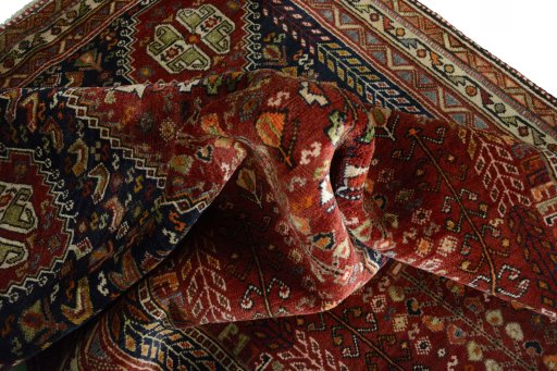 Surface texture of 2000s Shiraz rug with natural Wool and intricate pattern