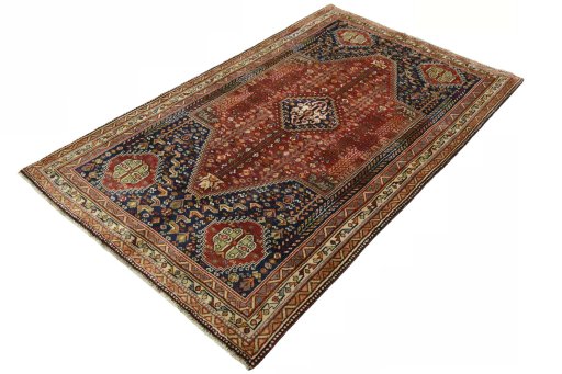 Corner detail of 2000s Shiraz rug showing border pattern and Wool pile