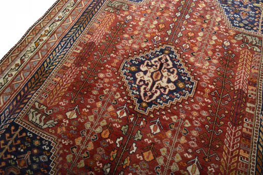Backside of handmade 2000s Shiraz rug showing knot structure and weave density