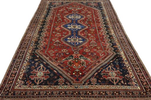Surface texture of 2000s Shiraz rug with natural Wool and intricate pattern