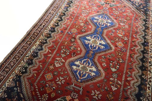 Backside of handmade 2000s Shiraz rug showing knot structure and weave density