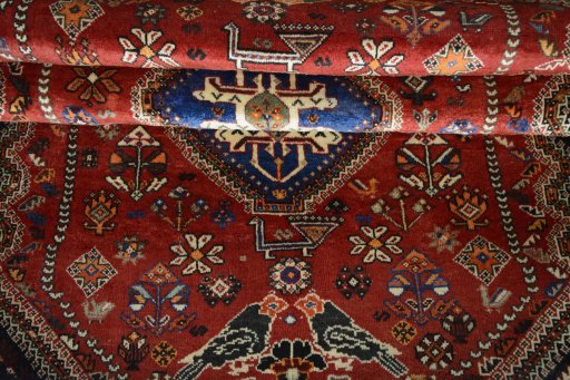 Full view of 2000s Shiraz rug from Iran / Persia, 267 × 169 cm in Red tones