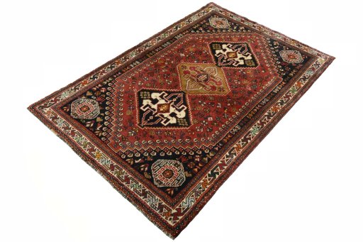 Corner detail of 2000s Shiraz rug showing border pattern and Wool pile