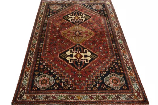 Surface texture of 2000s Shiraz rug with natural Wool and intricate pattern