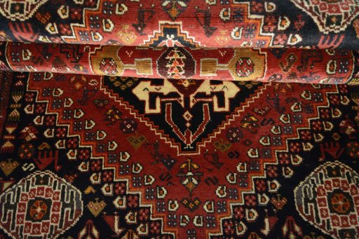 Full view of 2000s Shiraz rug from Iran / Persia, 182 × 121 cm in Red tones