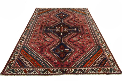Surface texture of 2000s Shiraz rug with natural Wool and intricate pattern