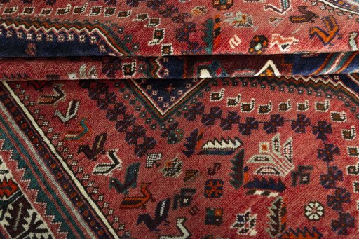 Full view of 2000s Shiraz rug from Iran / Persia, 252 × 178 cm in Red tones