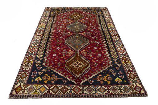 Surface texture of 2000s Shiraz rug with natural Wool and intricate pattern
