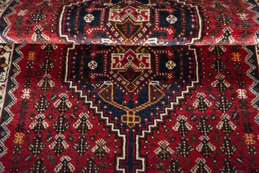 Full view of 2000s Shiraz rug from Iran / Persia, 150 × 108 cm in Red tones