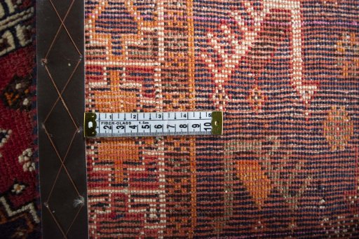 Backside of handmade 2000s Shiraz rug showing knot structure and weave density