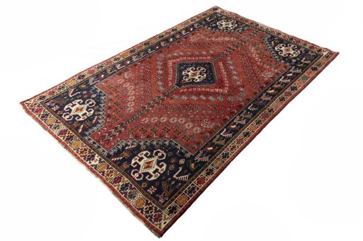 Corner detail of 2000s Shiraz rug showing border pattern and Wool pile