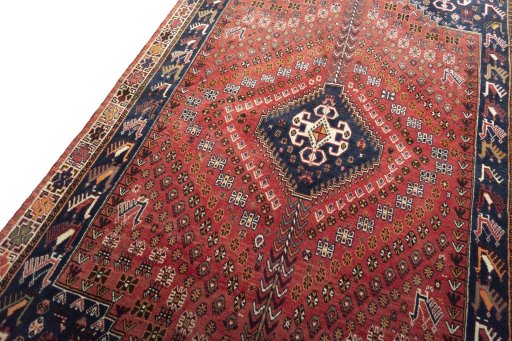Backside of handmade 2000s Shiraz rug showing knot structure and weave density