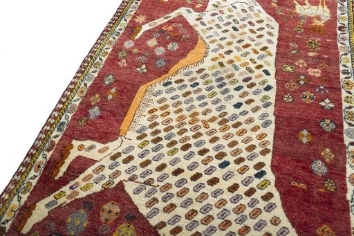Backside of handmade 2000s Shiraz rug showing knot structure and weave density