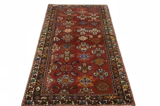 Surface texture of 2000s Shiraz rug with natural Wool and intricate pattern