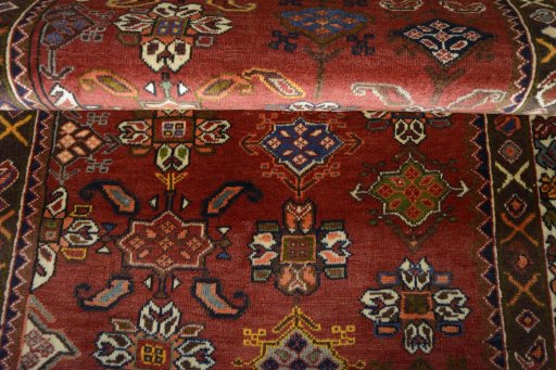 Full view of 2000s Shiraz rug from Iran / Persia, 165 × 96 cm in Red tones