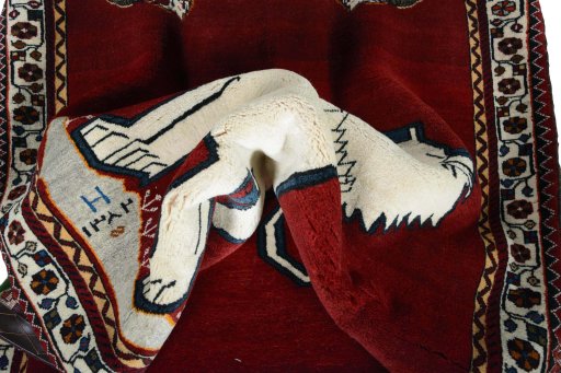 Corner detail of 2000s Shiraz rug showing border pattern and Wool pile