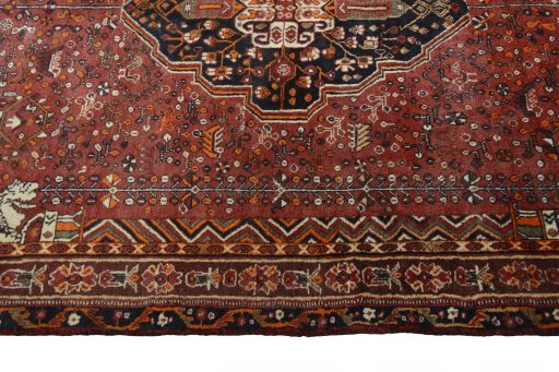 Corner detail of 2000s Shiraz rug showing border pattern and Wool pile