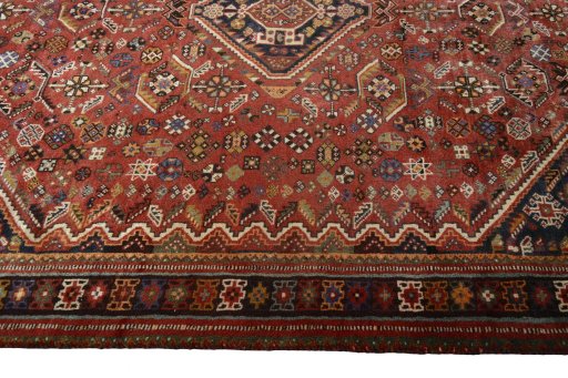Corner detail of 2000s Shiraz rug showing border pattern and Wool pile