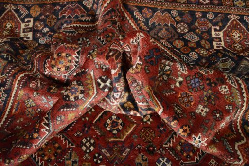 Surface texture of 2000s Shiraz rug with natural Wool and intricate pattern