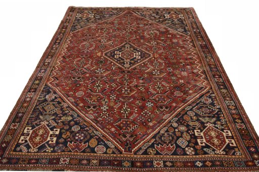 Surface texture of 2000s Shiraz rug with natural Wool and intricate pattern