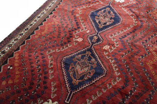 Backside of handmade 2000s Shiraz rug showing knot structure and weave density