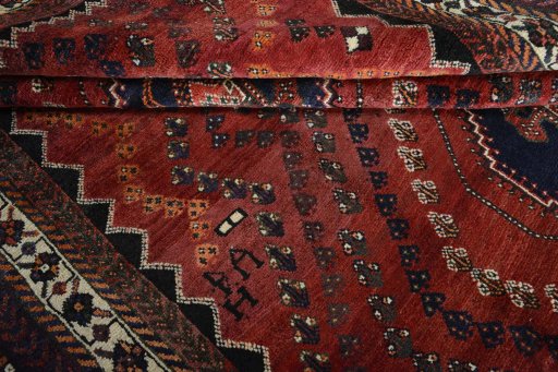 Full view of 2000s Shiraz rug from Iran / Persia, 304 × 212 cm in Red tones