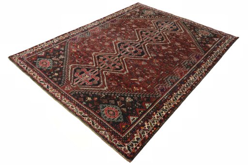 Corner detail of 2000s Shiraz rug showing border pattern and Wool pile