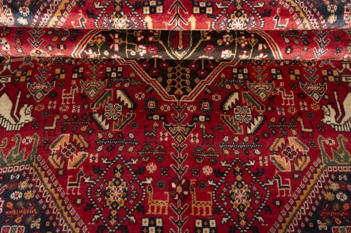 Corner detail of 2000s Shiraz rug showing border pattern and Wool pile