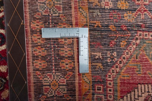 Surface texture of 2000s Shiraz rug with natural Wool and intricate pattern