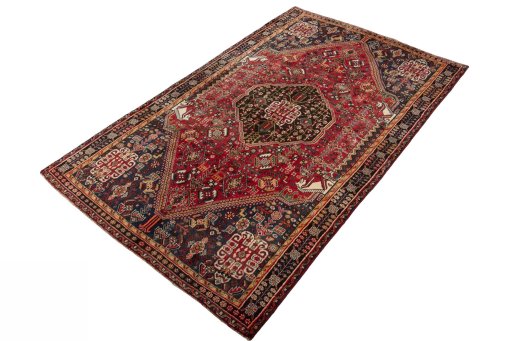 Corner detail of 2000s Shiraz rug showing border pattern and Wool pile